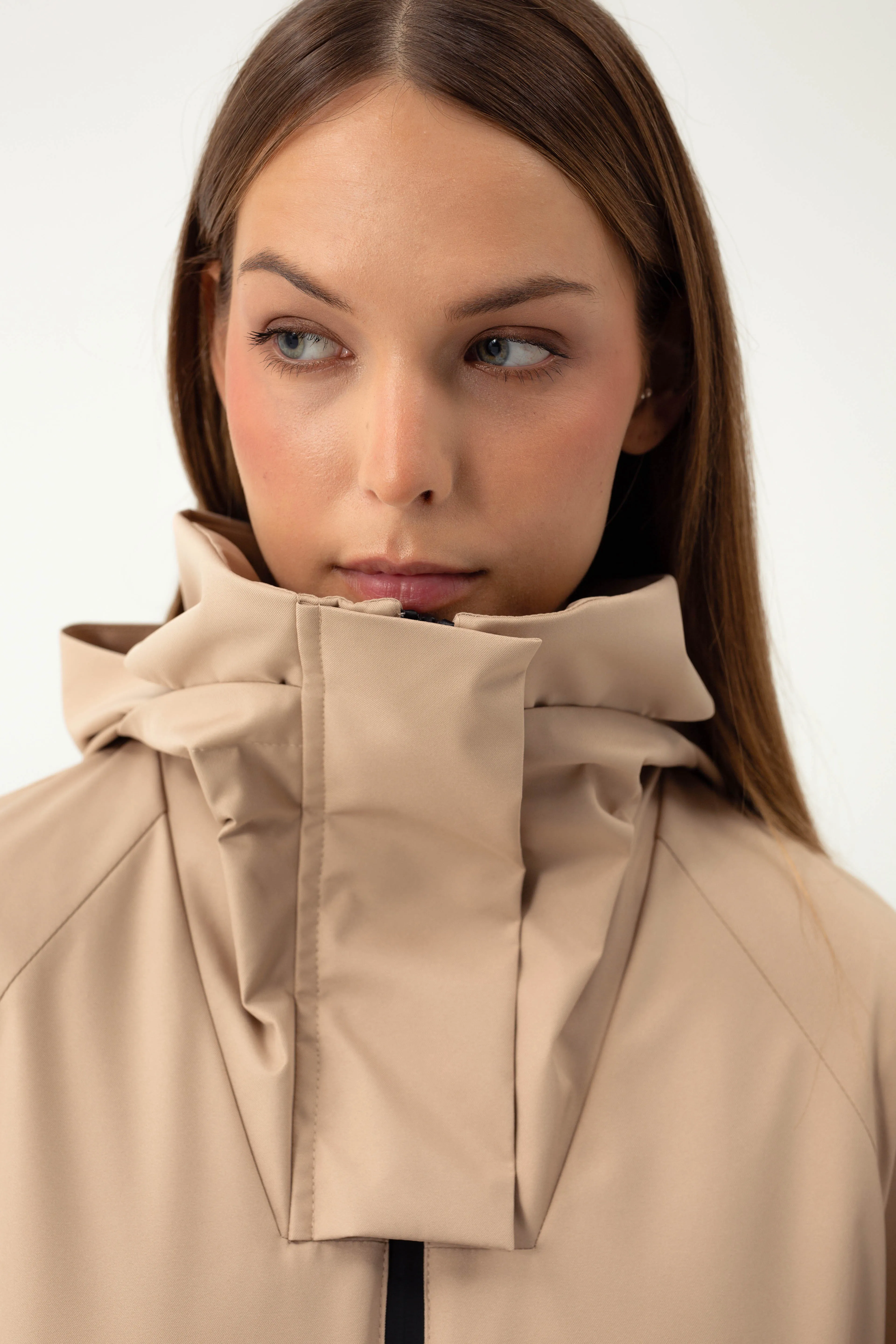 SAND COLORED RAINCOAT WITH HIDDEN HOOD